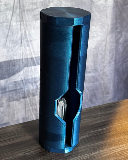 Blue cylindrical object on a wood textured surface