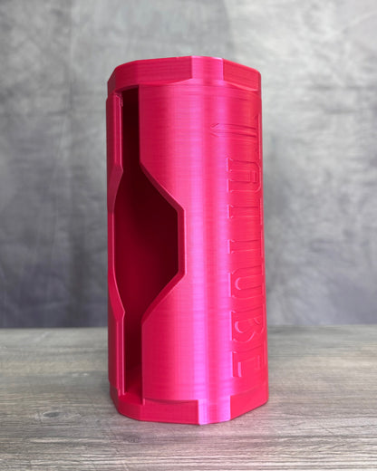Pink cylinder on wood surface